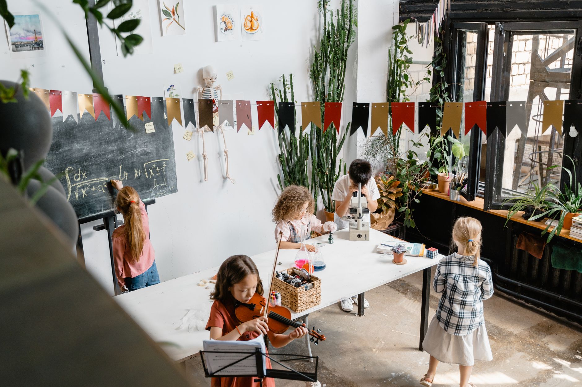 Engaging classroom where kids explore music and science, fostering curiosity.